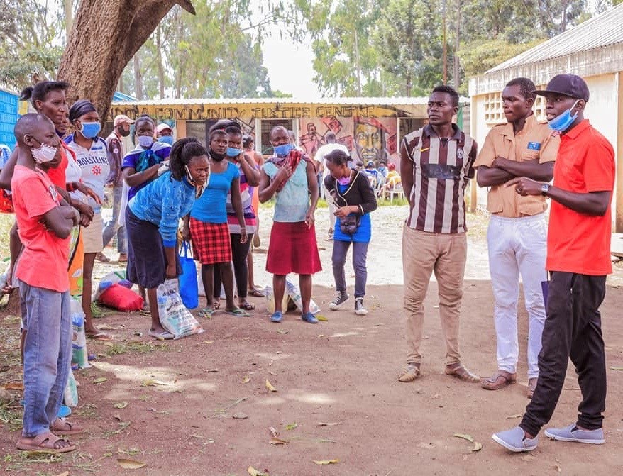 Members of the Social Justice Centres Working Group distribute foodstuffs to communities in Nairobi, Kenya.