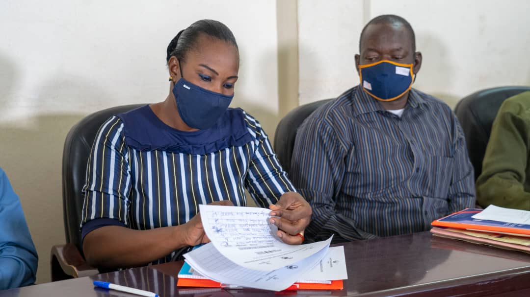 woman signs an agreement