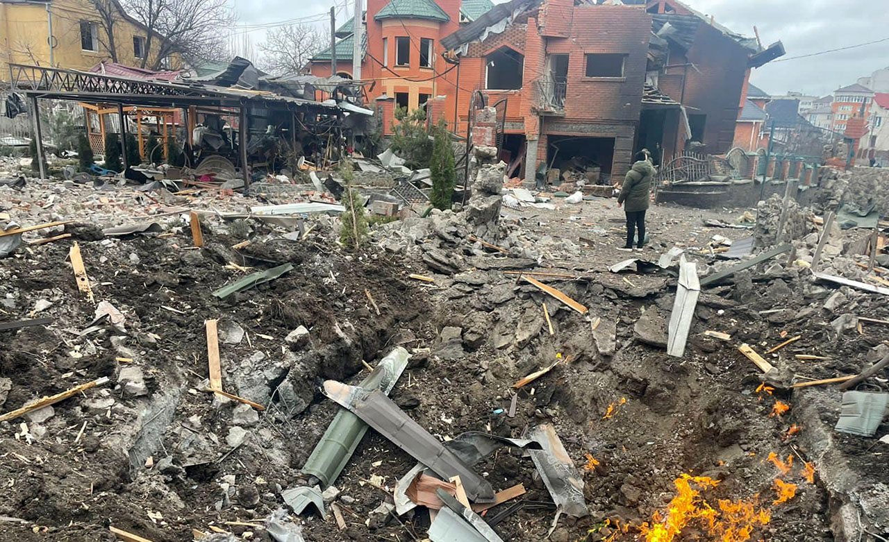 Man stands amidst ruins