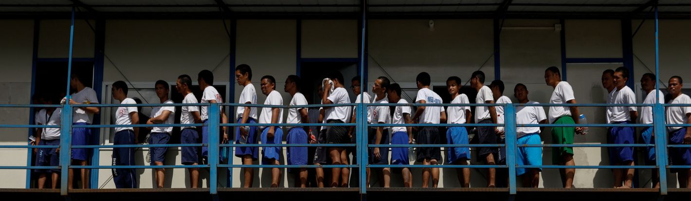 Drug rehab patients walk in formation to have lunch at the Mega Drug Abuse Treatment and Rehabilitation Center, in Nueva Ecija province, north of Manila, Philippines December 9, 2019. ©Reuters