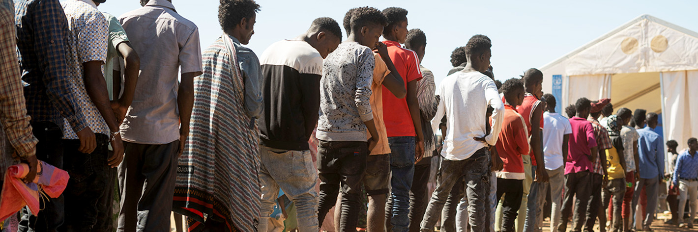 Ethiopian refugees from Tigray region wait in line to receive aid at the Um Rakuba refugee camp, the same camp that hosted Ethiopian refugees during the famine in the 1980s, some 80 kilometres from the Ethiopian-Sudan border in Sudan, 30 November 2020 (issued 02 December 2020).  ©EPA-EFE ALA KHEIR