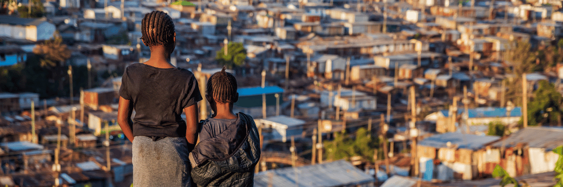 Young girls overlooking Kibera slum in Nairobi, Kenya.