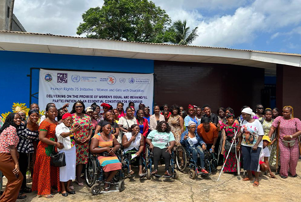 A large group of women posing for a photo at the event