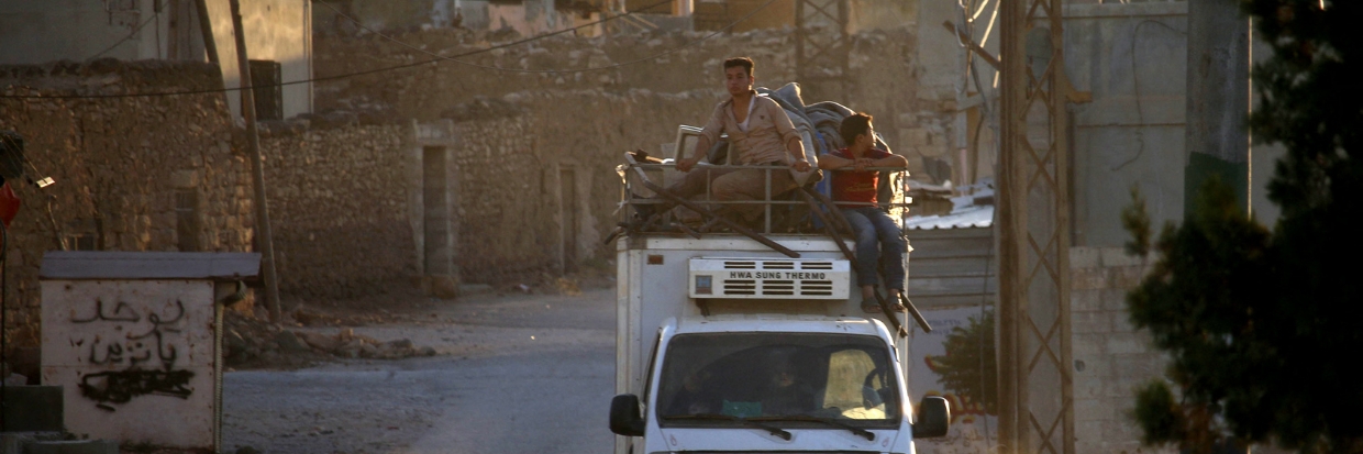 Syrian return to their homes in towns and villages situated on the eastern outskirts of Daraa on July 6, 2018. The Syrian regime reached a ceasefire deal with rebels in the country's south, the official SANA news agency said. © Mohamad ABAZEED / AFP 