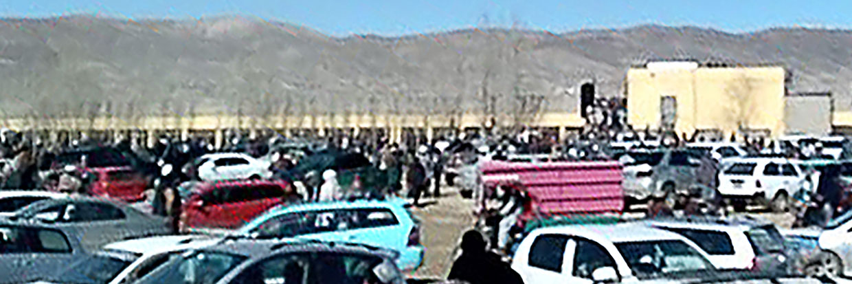 Afghan men leaving a football stadium after attending the public execution by Taliban authorities of two men convicted of murder, in Ghazni. February 22, 2024. © Photo by AFP