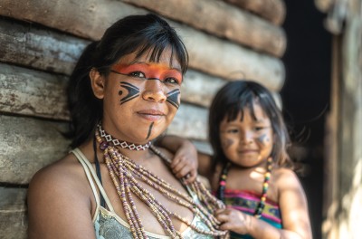 A Brazilian young woman and her child, portrait of Tupi Guarani ethnicity. © Credit Getty Images. 