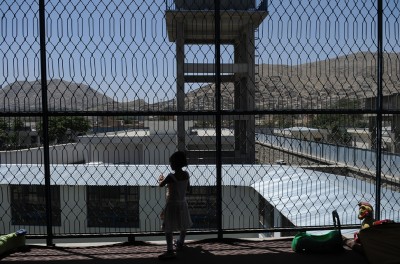 A girl stands in a playroom in the Kabul Female Prison and Detention Centre, Kabul, Afghanistan, June 2010.© UNICEF/UNI94658/Brooks