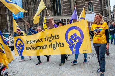 People march with a banner in support of intersex rights during a parade in Amsterdam. © SOPA Images/Ana Fernandez