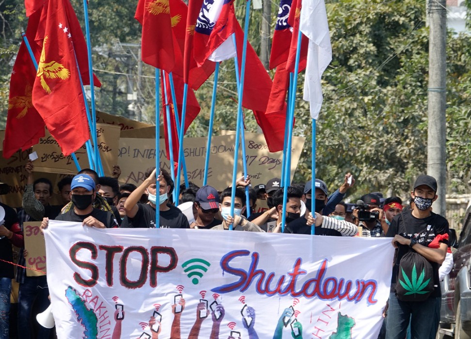 University students hold placards during a protest against the internet shutdown in Sittwe, Rakhine State, western Myanmar.