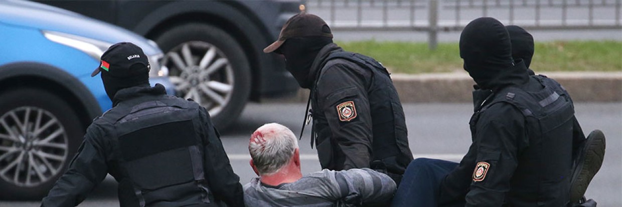 Law enforcement personnel detain a protestor in October 2020 Natalia Fedosenko/TASS via Reuters Connect  