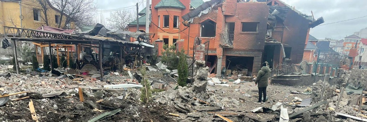 Man stands amidst ruins