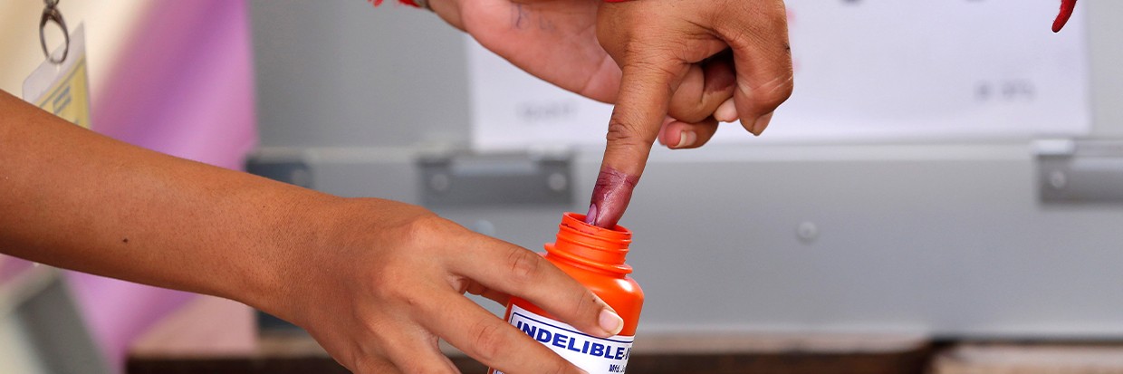 A voter has her finger ink-stained at a polling station during at last general election in Phnom Penh, Cambodia July 29, 2018. REUTERS/Darren Whiteside