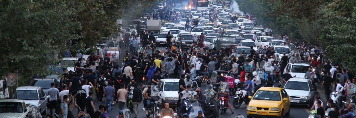 People clash with police during a protest following the death of Mahsa Amini, in Tehran, Iran, 21 September 2022. ©EPA-EFE