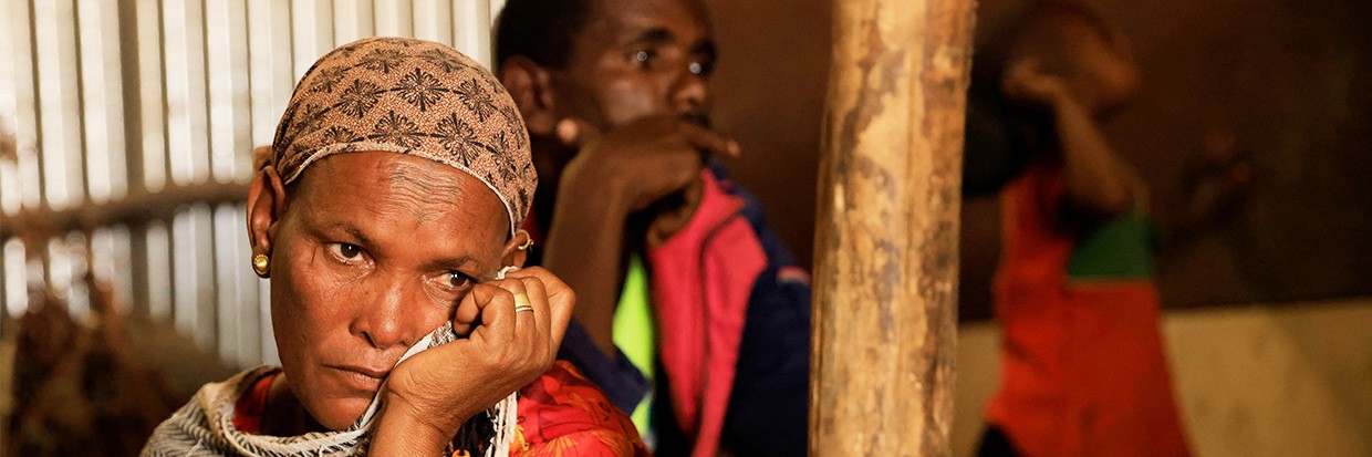 : iumto Gebresillasie, 50, displaced due to the fighting between Tigray People's Liberation Front (TPLF) forces and Ethiopian National Defence Force (ENDF) allied with Amhara Special Forces, sits in front of her shelter at the Abi Adi camp for the Internally Displaced Persons in Abi Adi, Tigray Region, Ethiopia, June 24, 2023. © REUTERS/Tiksa Neger