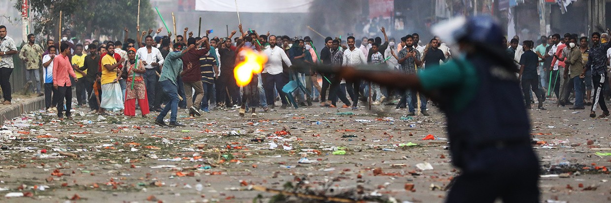 Police personnel stand guard during a rally by Bangladesh Nationalist party (BNP) activists demanding the resignation of Prime Minister Sheikh Hasina and the release of BNP Chairperson Begum Khaleda Zia, in Dhaka on October 28, 2023. ©Credit: Photo by Ahmed Salahuddin/NurPhoto