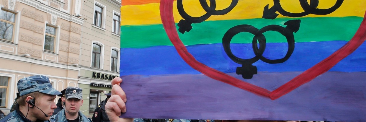 A gay rights activist marches with a placard during a May Day rally in St. Petersburg  REUTERS/Alexander Demianchuk 