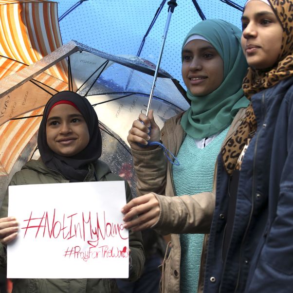 Women hold a placard during a demonstration. Reuters/Stefano Rellandini