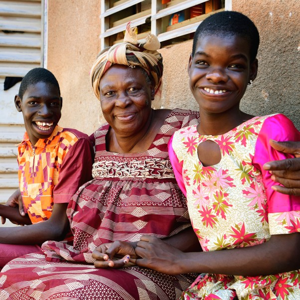 Smiling woman with boy and girl