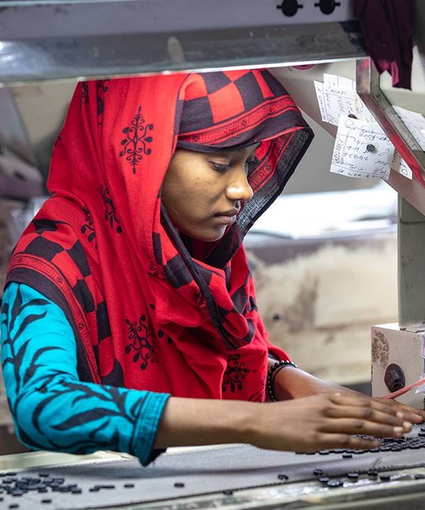 Workers preparing button in a factory in Savar on August 21, 2023. Credit: Ahmed Salahuddin via Reuters Connect