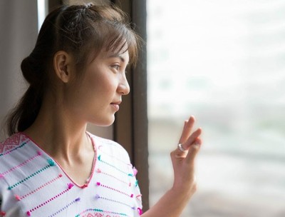 Woman looking out a window