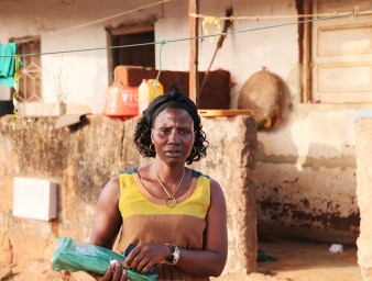 Arminda Sa poses for a photo outside her home in Bissau, Guinea-Bissau, February 6, 2019. © Thomson Reuters Foundation/Nellie Peyton