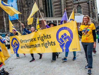 People march with a banner in support of intersex rights during a parade in Amsterdam. © SOPA Images/Ana Fernandez