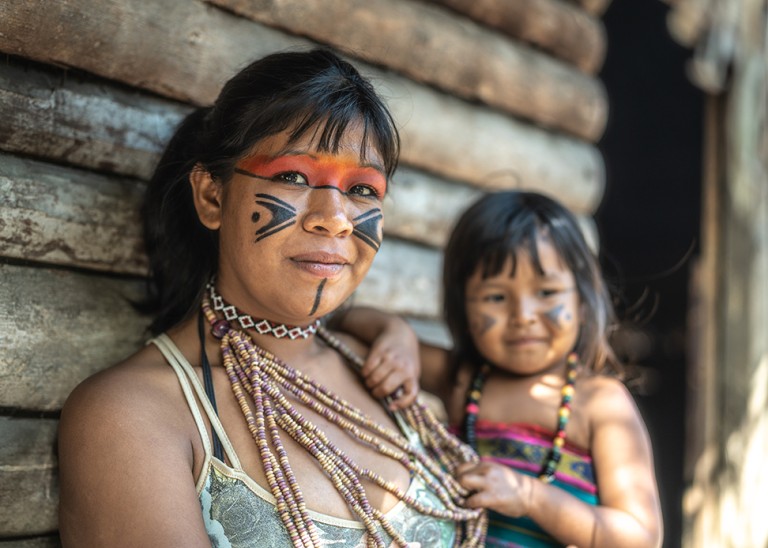 A Brazilian young woman and her child, portrait of Tupi Guarani ethnicity. © Credit Getty Images. 