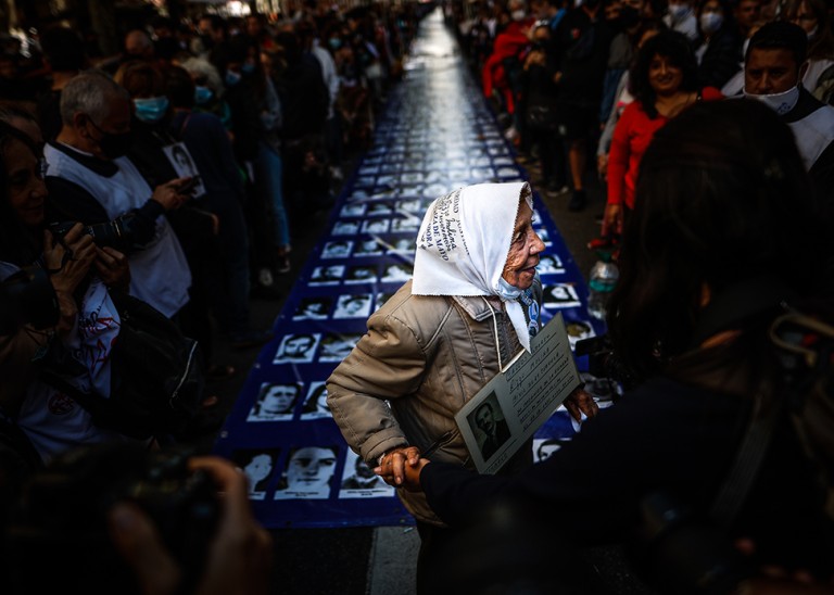 Argentines participate in a march for National Day of Memory for Truth and Justice, which commemorates the 1976 military coup. © Credit – EPA-EFE/Juan Ignacio Roncoroni.