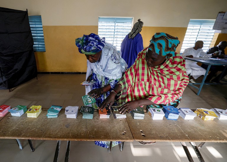 Women prepare to cast their ballot at the polling station at Ndiaganiao in Mbour, Senegal. © REUTERS/Zohra Bensemra